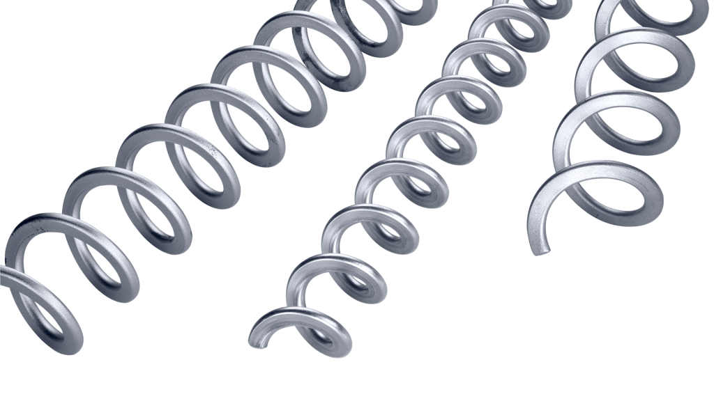 Several metal coil springs of varying sizes are arranged diagonally on a white background.