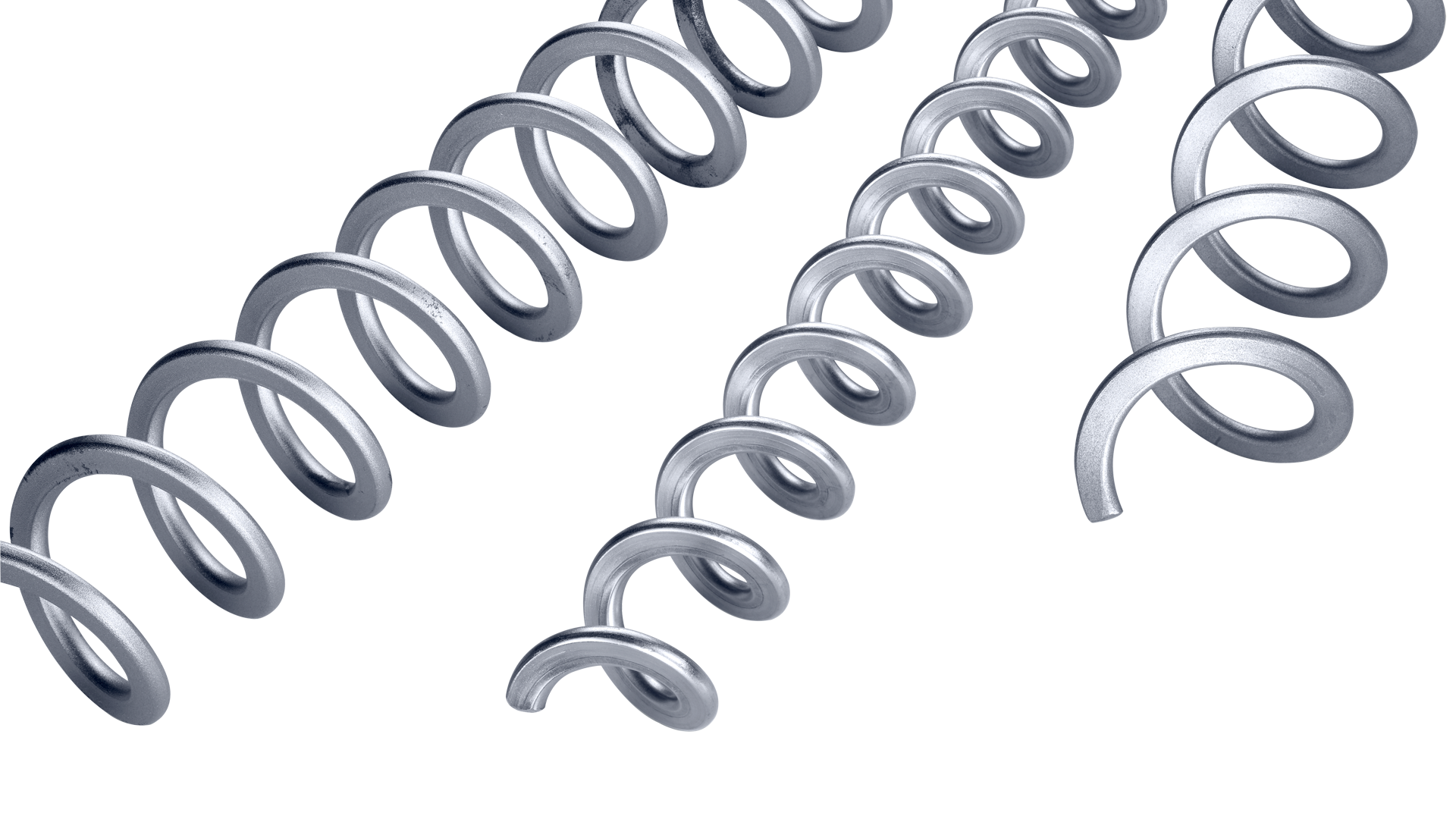 Several metal coil springs of varying sizes are arranged diagonally on a white background.