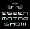 Logo for the Essen Motor Show featuring a stylized outline of a car above the words ESSEN MOTOR SHOW in metallic, futuristic font on a black background.